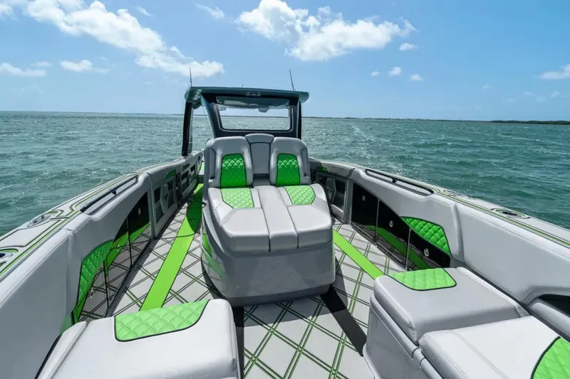 Slide: The Image of Interior of 2026 Deep Impact 399 Sport boat with modern design and green accents. - 13