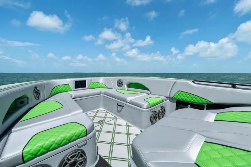 Slide: The Image of Luxury 2026 Deep Impact 399 Sport boat interior with green accents on open water. - 15