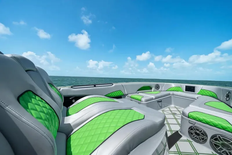 Slide: The Image of Four powerful outboard motors on a 2026 Deep Impact 399 Sport boat. - 18