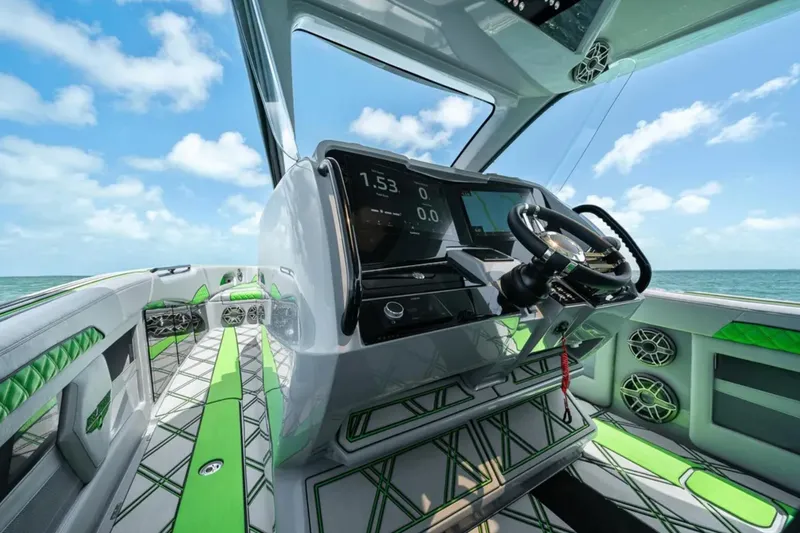 Slide: The Image of 2026 Deep Impact 399 Sport boat cruising on open water, showcasing sleek design and speed. - 26