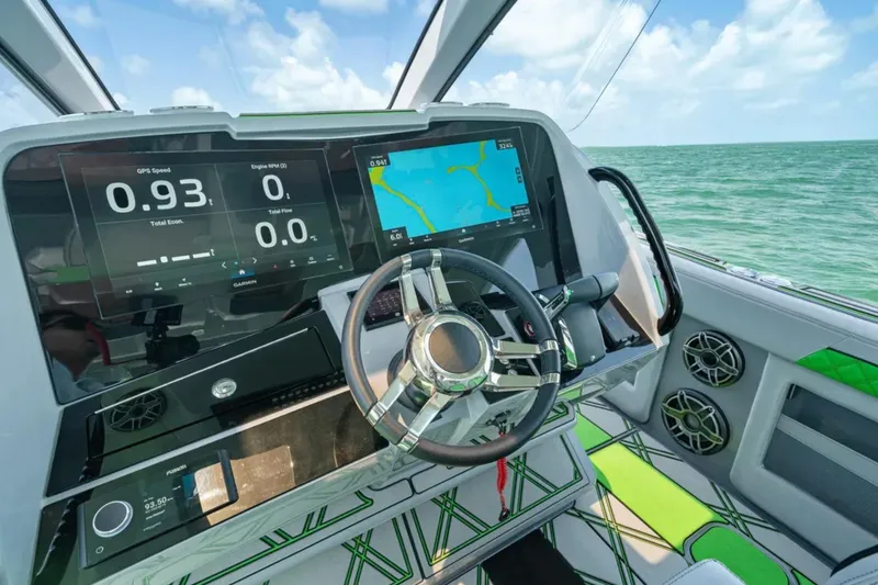 Slide: The Image of 2026 Deep Impact 399 Sport boat cruising on open water, showcasing sleek design and powerful engines. - 27