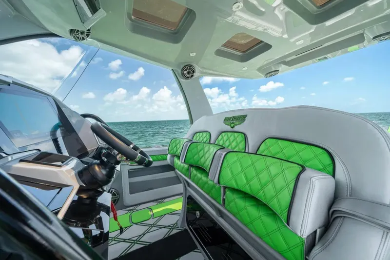 Slide: The Image of 2026 Deep Impact 399 Sport boat speeding on open water. - 28