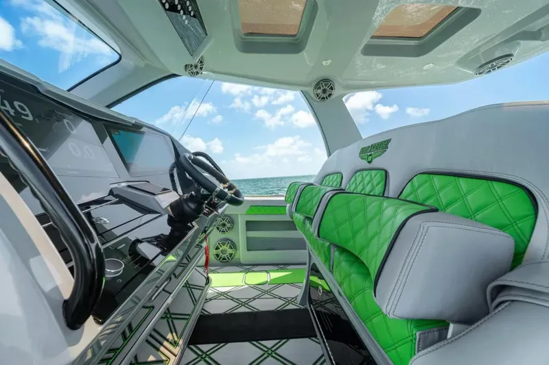 Slide: The Image of 2026 Deep Impact 399 Sport boat cruising on open water, showcasing sleek design and powerful engines. - 29