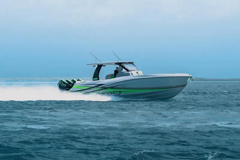 Slide: The Image of 2026 Deep Impact 399 Sport boat cruising on open water, showcasing sleek design and performance. - 3