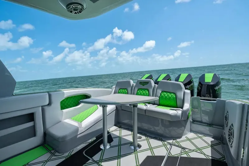 Slide: The Image of 2026 Deep Impact 399 Sport boat cruising on open water, showcasing sleek design and powerful engines. - 31