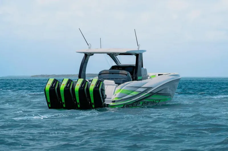 Slide: The Image of Luxury interior of 2026 Deep Impact 399 Sport boat with green accents on water. - 6