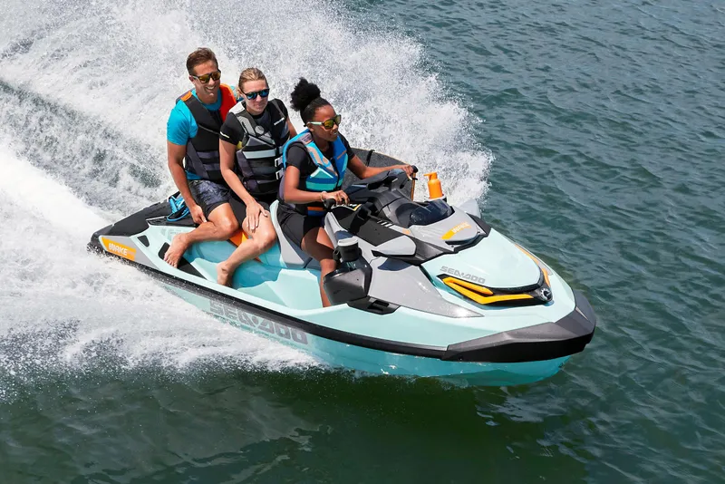 The Image of Manufacturer Provided Image: 2022 Sea-Doo Wake Pro 230 jet ski with three riders on the water. - 1