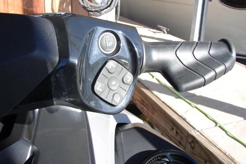 Slide: The Image of Close-up of 2022 Sea-Doo Wake Pro 230 handlebar controls. - 10