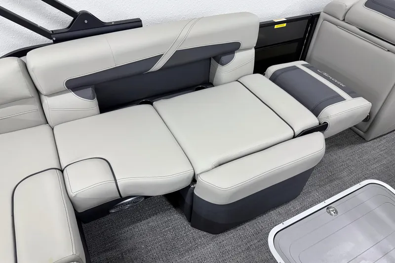 Slide: The Image of 2025 Barletta Cabrio 24U boat interior with luxurious gray seating and modern design. - 14