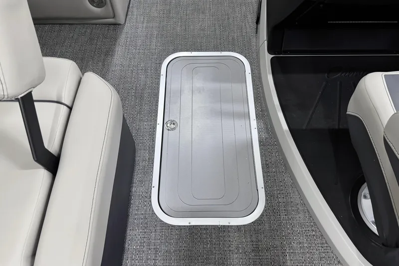 Slide: The Image of Interior of 2025 Barletta Cabrio 24U boat, featuring sleek seating and floor storage. - 21