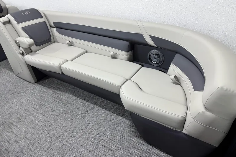 Slide: The Image of 2025 Barletta Cabrio 24U boat seating, featuring elegant gray upholstery and integrated speaker. - 25