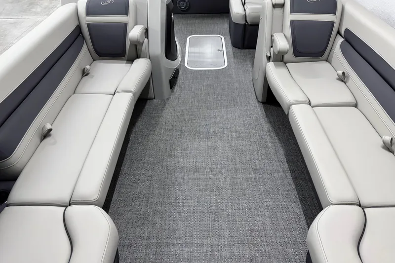 Slide: The Image of 2025 Barletta Cabrio 24U interior with gray seating and carpet flooring. - 27