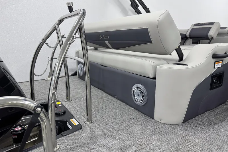 Slide: The Image of 2025 Barletta Cabrio 24U boat interior with sleek seating and stainless steel railings. - 6