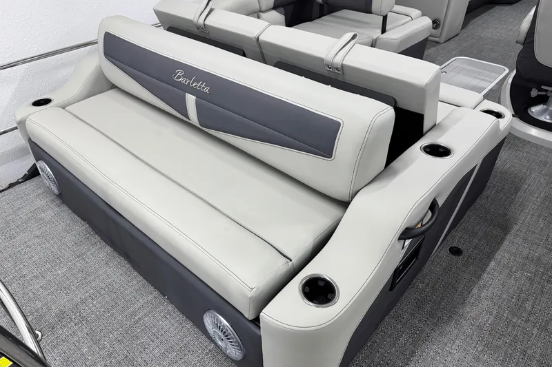 Slide: The Image of 2025 Barletta Cabrio 24U boat seating with cup holders and sleek design. - 7