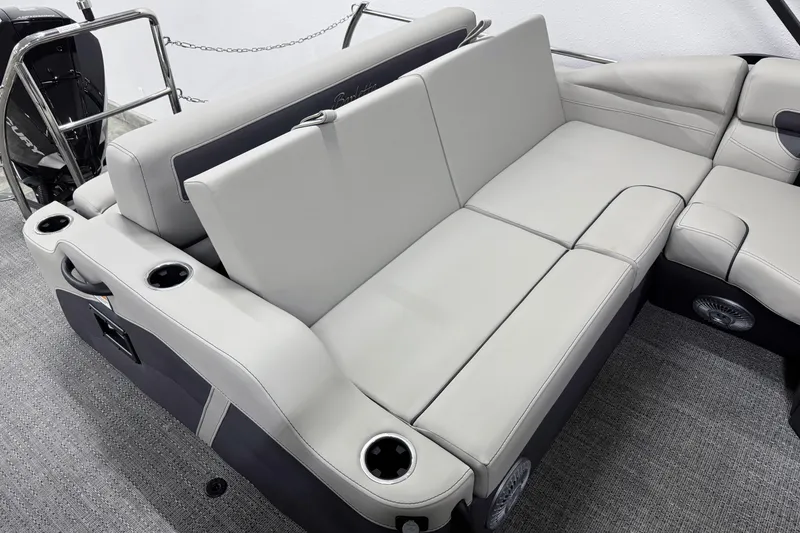 Slide: The Image of 2025 Barletta Cabrio 24U boat interior with plush seating and cup holders. - 8