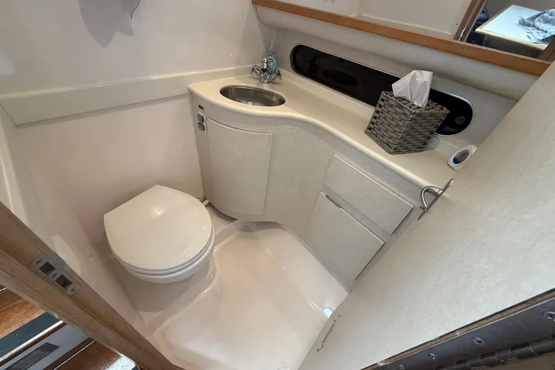 Slide: The Image of Compact bathroom in 1997 Blackfin Combi 33 boat with toilet and sink. - 20