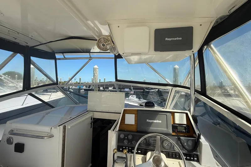 Slide: The Image of Interior view of 1997 Blackfin Combi 33 boat cockpit with Raymarine equipment. - 23