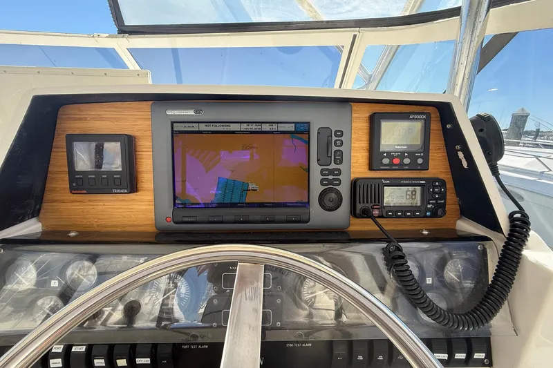 Slide: The Image of 1997 Blackfin Combi 33 boat dashboard with navigation and communication equipment. - 24