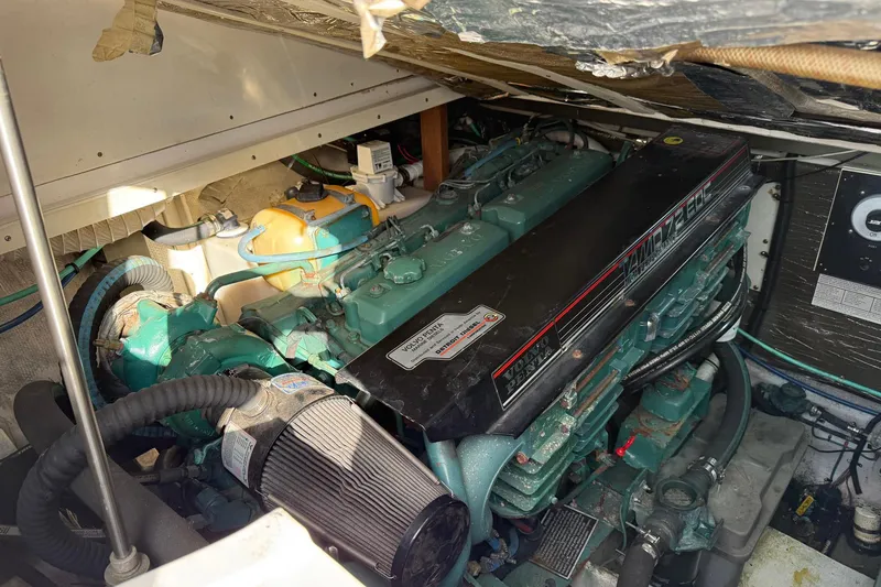 Slide: The Image of Engine compartment of a 1997 Blackfin Combi 33 boat, featuring a Volvo Penta engine. - 35