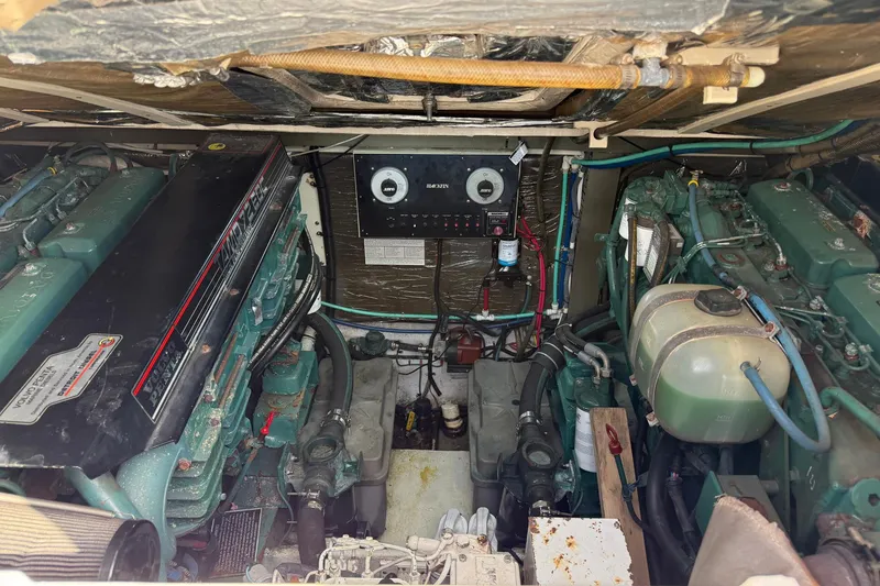 Slide: The Image of Engine room of a 1997 Blackfin Combi 33 boat, featuring dual Volvo Penta engines. - 37