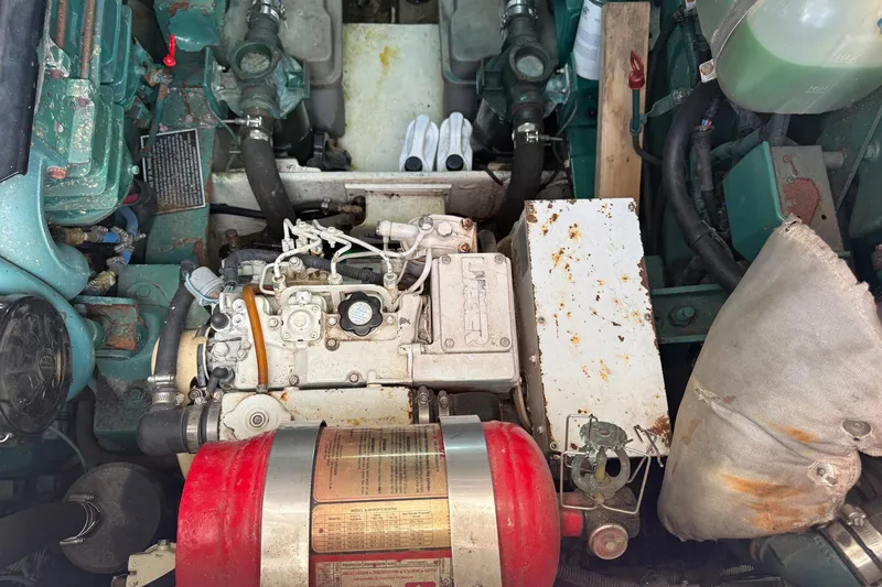 Slide: The Image of Engine compartment of a 1997 Blackfin Combi 33 boat, showing mechanical components and hoses. - 38