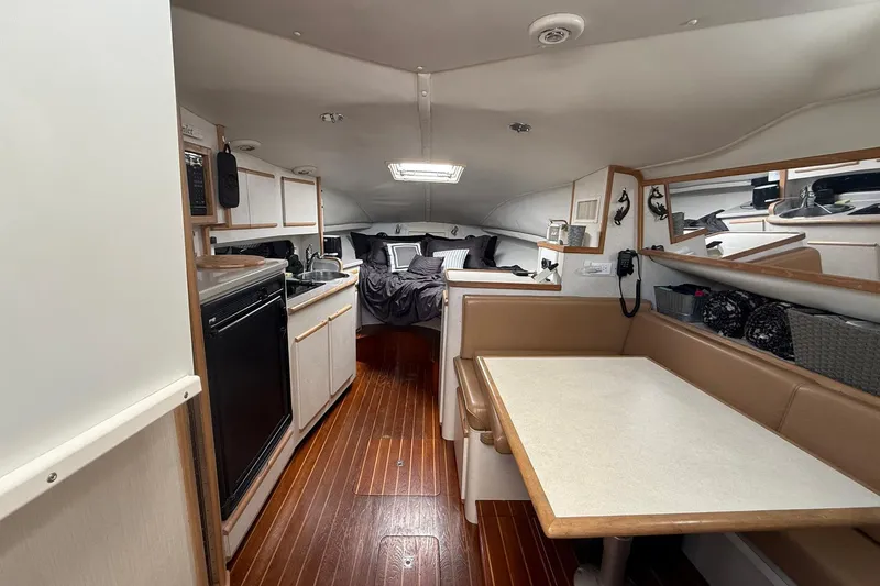 Slide: The Image of Interior of 1997 Blackfin Combi 33 yacht with kitchen, dining area, and sleeping quarters. - 6