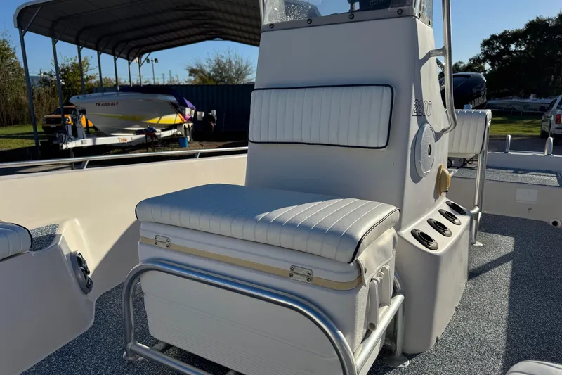 Slide: The Image of 2001 Pathfinder 2200 V boat interior with cushioned seating and console. - 10