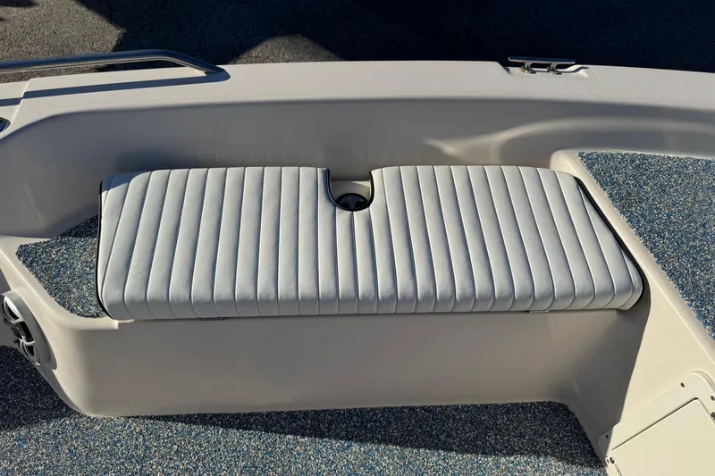 Slide: The Image of 2001 Pathfinder 2200 V boat seat with striped upholstery and textured flooring. - 14
