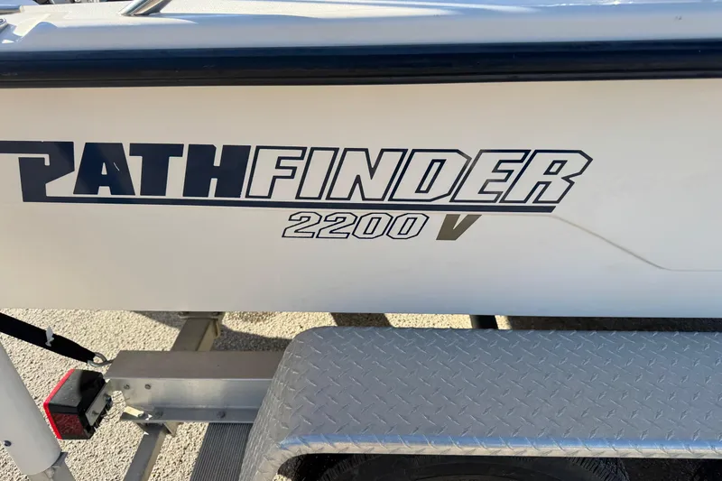 Slide: The Image of 2001 Pathfinder 2200 V boat logo on trailer, close-up view. - 3