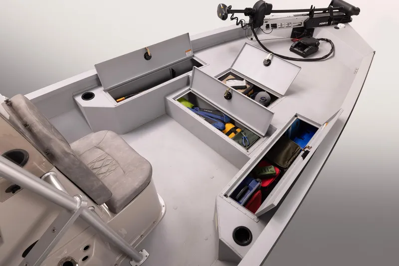 Slide: The Image of 2026 G3 Bay 22 GX boat interior with open storage compartments and seating. - 6