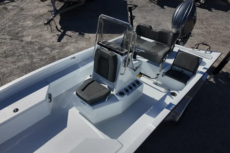 Slide: The Image of 2026 Xpress H22B Bay boat interior with modern seating and steering console. - 10