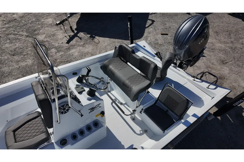 Slide: The Image of 2026 Xpress H22B Bay boat interior with seating and steering wheel. - 11