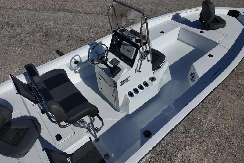 Slide: The Image of 2026 Xpress H22B Bay boat interior with steering console and seating. - 7