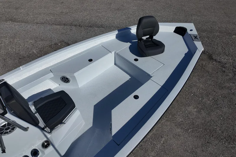 Slide: The Image of 2026 Xpress H22B Bay boat deck with seating and storage compartments. - 8