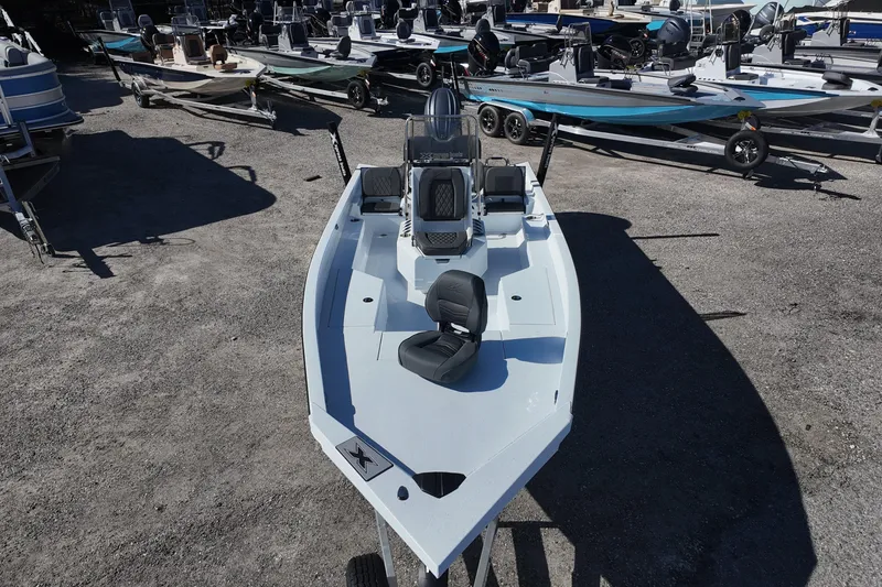 Slide: The Image of 2026 Xpress H22B Bay boat displayed in a dealership lot. - 9