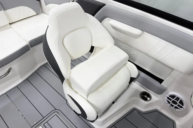 Slide: The Image of 2025 Chaparral 21 SSi boat interior with white seating and modern design. - 15