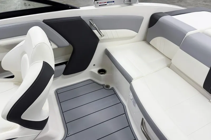 Slide: The Image of 2025 Chaparral 21 SSi boat interior with sleek white and gray seating design. - 16