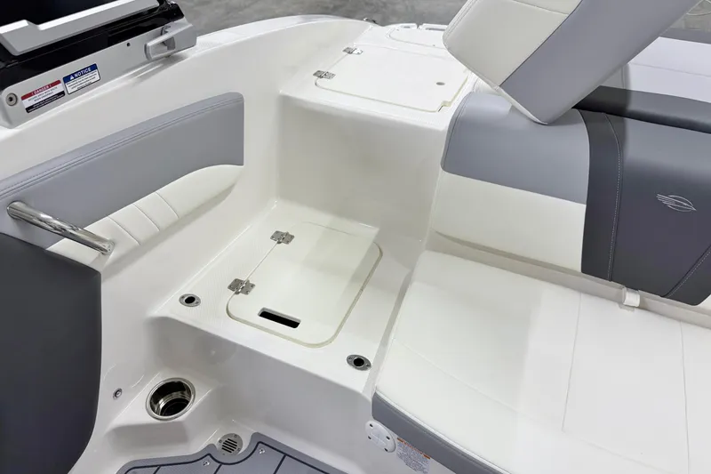 Slide: The Image of Interior view of 2025 Chaparral 21 SSi boat, featuring sleek seating and storage. - 18