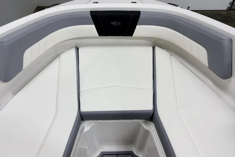 Slide: The Image of 2025 Chaparral 21 SSi boat interior with white and gray cushioned seating. - 26