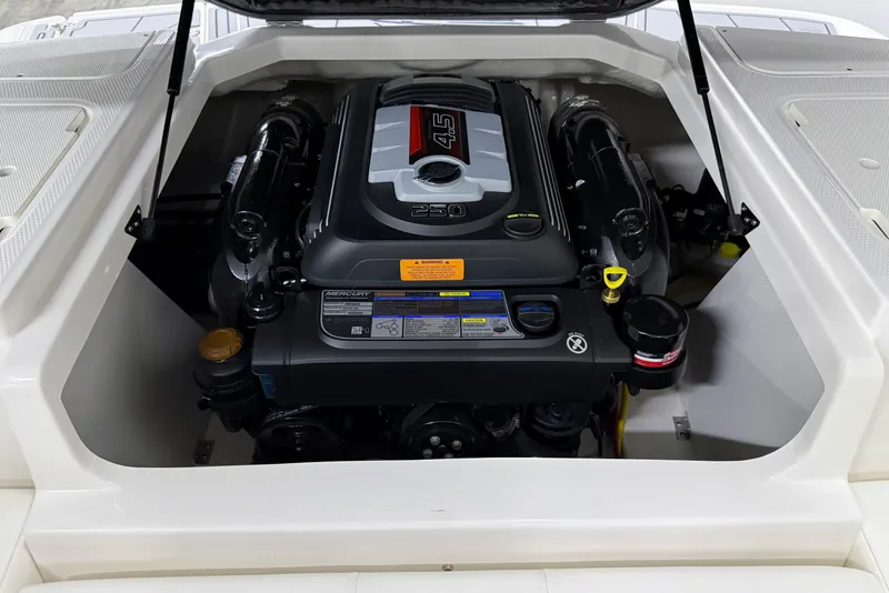 Slide: The Image of 2025 Chaparral 21 SSi boat engine compartment with Mercury 4.5L engine. - 28