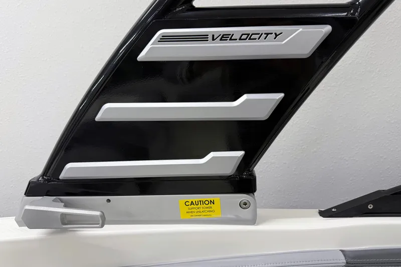 Slide: The Image of 2025 Chaparral 21 SSi boat detail with "Velocity" branding and caution label. - 30