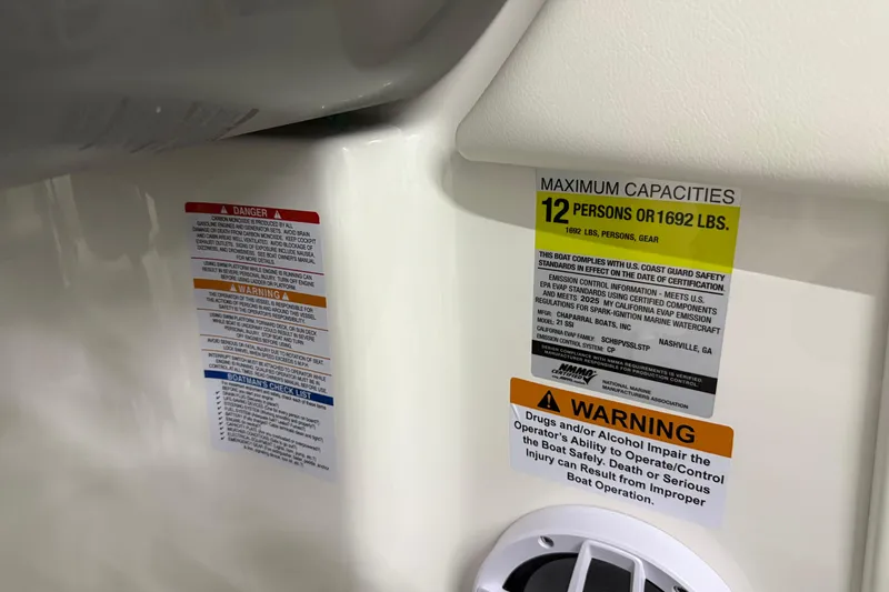 Slide: The Image of Safety and capacity labels on 2025 Chaparral 21 SSi boat, maximum 12 persons or 1692 lbs. - 31