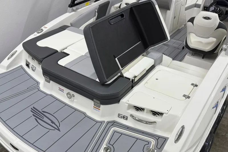 Slide: The Image of 2025 Chaparral 21 SSi boat interior with open storage and seating area. - 4