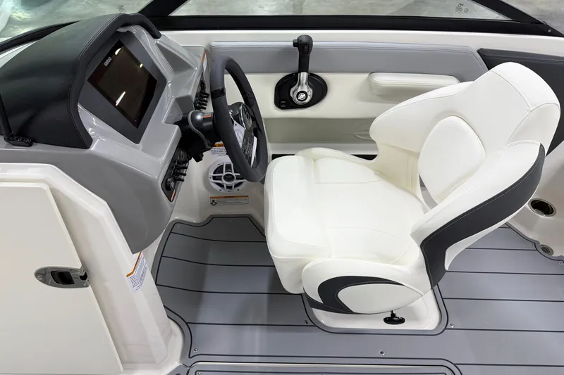 Slide: The Image of 2025 Chaparral 21 SSi boat interior with modern dashboard and comfortable seating. - 8