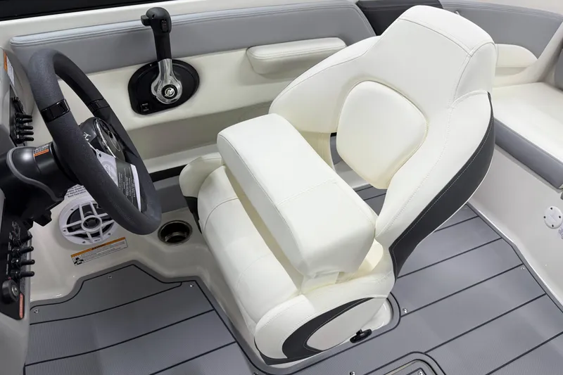 Slide: The Image of 2025 Chaparral 21 SSi boat interior with white captain's seat and steering wheel. - 9
