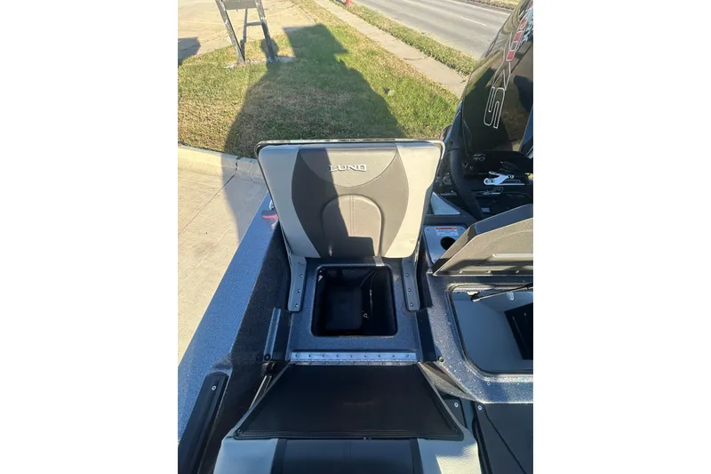 Slide: The Image of 2026 Lund 202 Pro-V GL boat storage compartments open, showcasing interior design. - 25