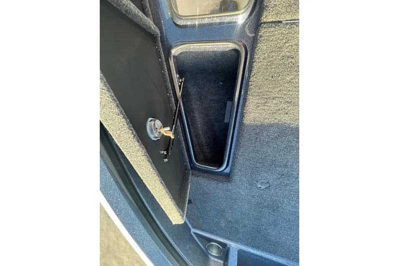 Slide: The Image of Interior storage compartment of 2026 Lund 202 Pro-V GL boat. - 32