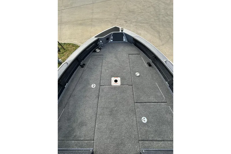 Slide: The Image of 2026 Lund 219 Pro-V GL boat on trailer, parked in snowy lot. - 12