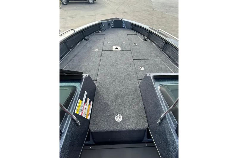 Slide: The Image of 2026 Lund 219 Pro-V GL boat deck with storage compartments, viewed from above. - 22