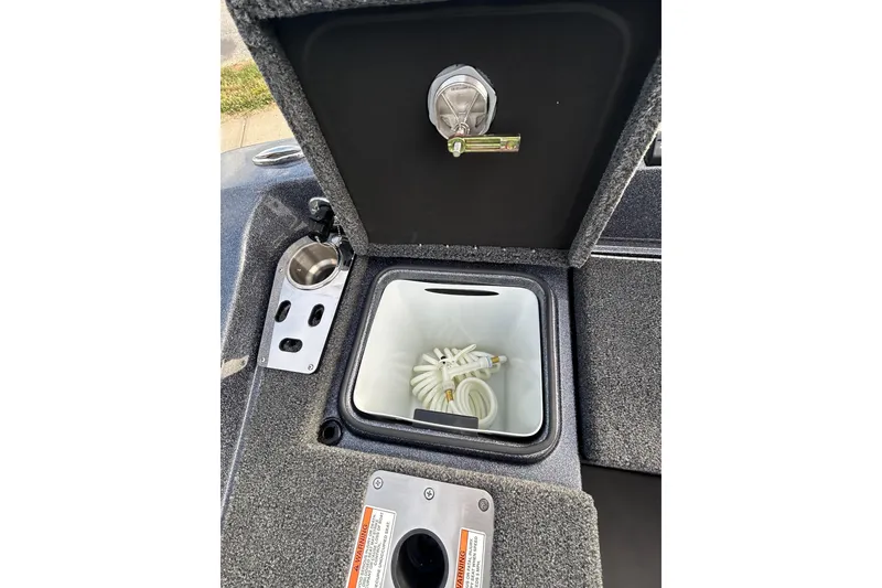 Slide: The Image of Interior view of 2026 Lund 219 Pro-V GL boat, featuring sleek seating and dashboard. - 23